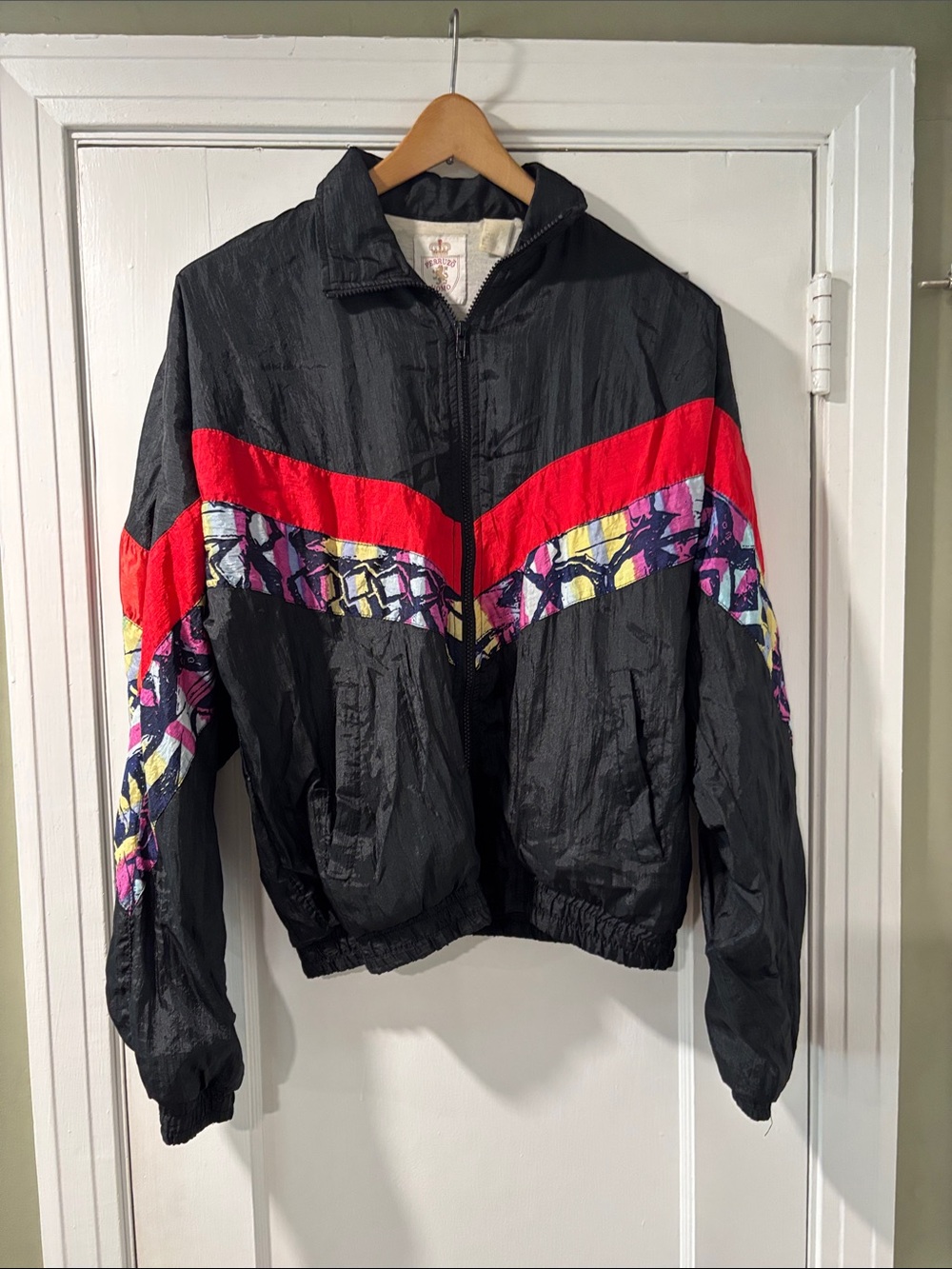 Vintage Black Windbreaker Jacket with Red Chevron and Multicolor Accent
